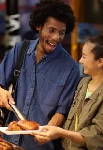 A man and his friend getting food