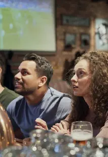 A group of friends watching soccer at Game Day Grill