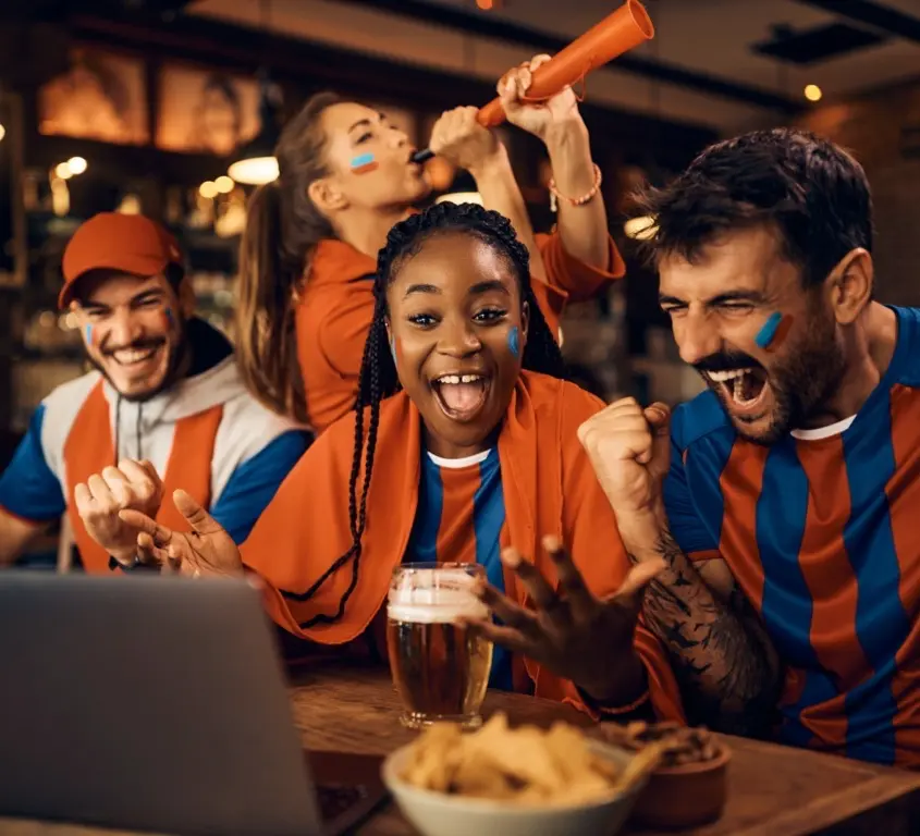 A photo of happy people eating at Game Day Grill
