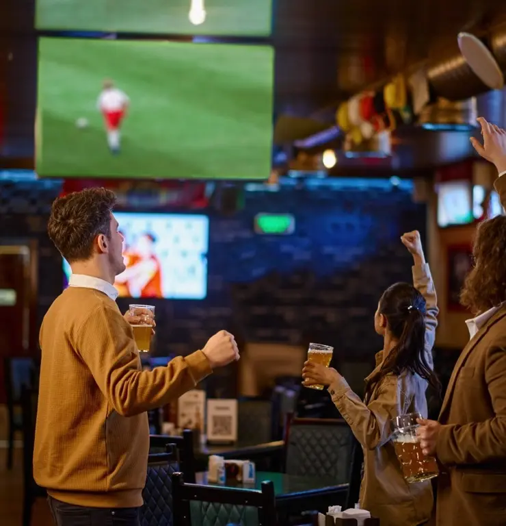 A group of friends enjoying a meal at Game Day Grill.