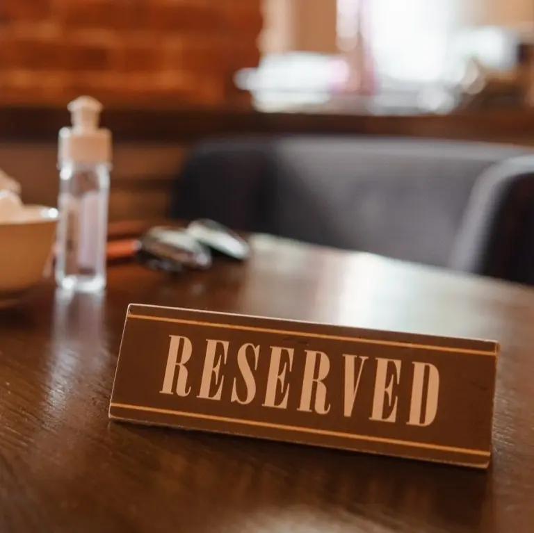 A table with a reservation sign on it